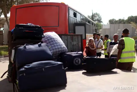 Palestinians arrive at the Rafah border crossing at the southern Gaza Strip October 15, 2015. Egypt opened the Rafah border crossing on Thursday for one day to allow stranded Palestinians to return to the Gaza Strip, off...