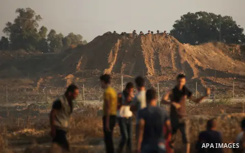Palestinian protesters clash with Israeli troops near the border between Israel and central Gaza Strip October 15, 2015. Thirty-two Palestinians and seven Israelis have been killed in the past two weeks of bloodshed. The...
