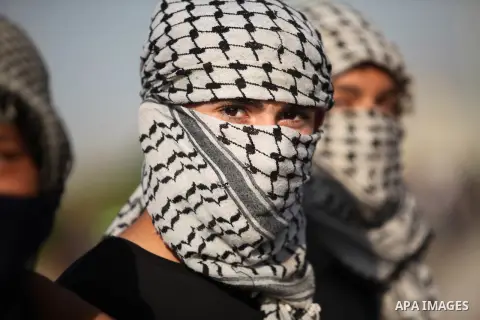 Masked Palestinian protersters look on during clashes with Israeli security forces at the Erez crossing checkpoint in the northern Gaza Strip October 16, 2015. The unrest that has engulfed Jerusalem and the occupied West...