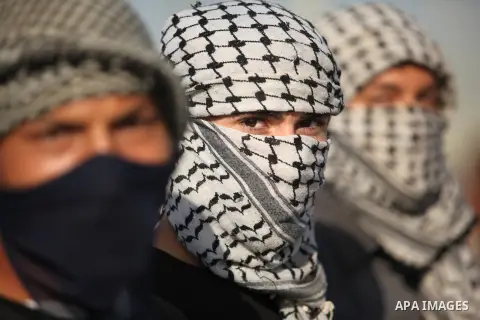 Masked Palestinian protersters look on during clashes with Israeli security forces at the Erez crossing checkpoint in the northern Gaza Strip October 16, 2015. The unrest that has engulfed Jerusalem and the occupied West...