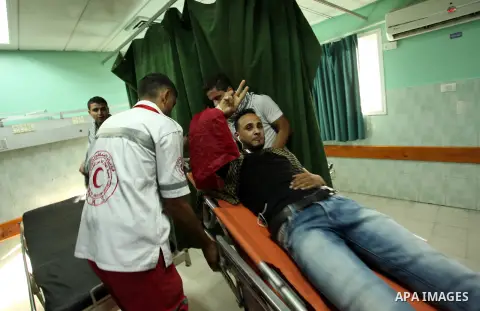 An injured Palestinian protester, who was wounded during clashes with Israeli security forces in the east of Gaza city, recieves treatment at al-Shifa hospital in Gaza city on October 16, 2015. The unrest that has engulf...