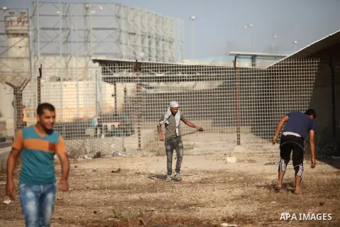 Palestinian protesters clash with Israeli security forces at the Erez crossing checkpoint in the northern Gaza Strip October 16, 2015. The unrest that has engulfed Jerusalem and the occupied West Bank, the most serious i...