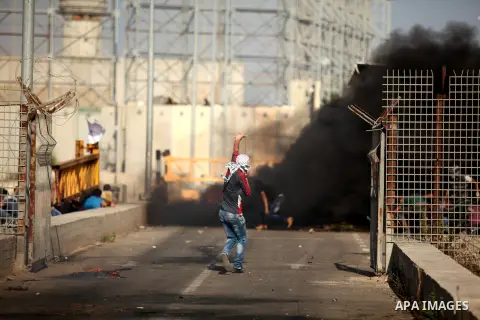 Palestinian protesters clash with Israeli security forces at the Erez crossing checkpoint in the northern Gaza Strip October 16, 2015. The unrest that has engulfed Jerusalem and the occupied West Bank, the most serious i...