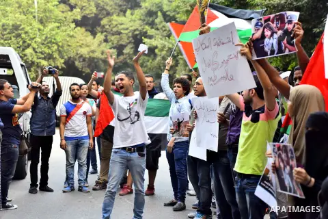 Egyptian protesters shot slogans during a demonstration expressing solidarity with Palestinians, outside the Palestinian Embassy in Cairo, October 16, 2015. According to local reports a group of protesters expressed thei...