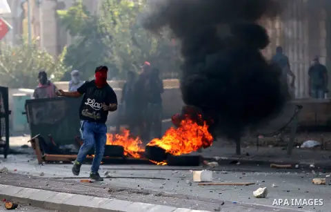 A Palestinian protester hurls stones towards Israeli security forces during clashes at the main entrance of the West Bank city of Bethlehem on October 16, 2015. The unrest that has engulfed Jerusalem and the occupied Wes...