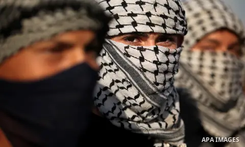 Masked Palestinian protersters look on during clashes with Israeli security forces at the Erez crossing checkpoint in the northern Gaza Strip October 16, 2015. The unrest that has engulfed Jerusalem and the occupied West...
