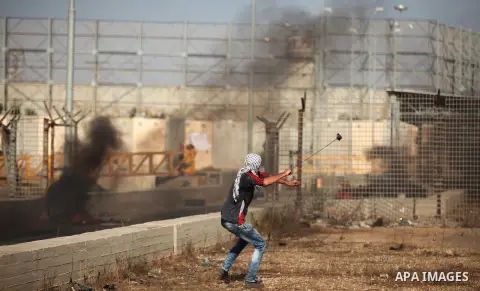 Palestinian protesters clash with Israeli security forces at the Erez crossing checkpoint in the northern Gaza Strip October 16, 2015. The unrest that has engulfed Jerusalem and the occupied West Bank, the most serious i...