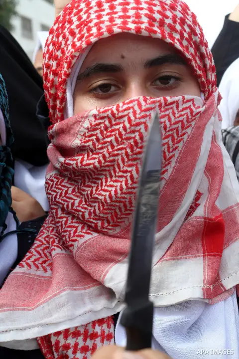 Palestinian school girls take part in an anti-Israel protest in Khan Younis in the southern in Gaza strip, on Oct. 18, 2015. Israel pressed ahead with major security measures after five more stabbing incidents, while ult...