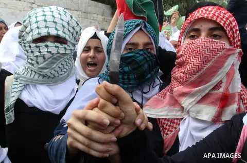 Palestinian school girls take part in an anti-Israel protest in Khan Younis in the southern in Gaza strip, on Oct. 18, 2015. Israel pressed ahead with major security measures after five more stabbing incidents, while ult...