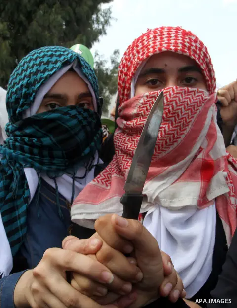 Palestinian school girls take part in an anti-Israel protest in Khan Younis in the southern in Gaza strip, on Oct. 18, 2015. Israel pressed ahead with major security measures after five more stabbing incidents, while ult...