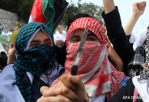 Palestinian school girls take part in an anti-Israel protest in Khan Younis in the southern in Gaza strip, on Oct. 18, 2015. Israel pressed ahead with major security measures after five more stabbing incidents, while ult...