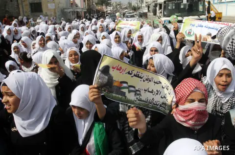Palestinian school girls take part in an anti-Israel protest in Khan Younis in the southern in Gaza strip, on Oct. 18, 2015. Israel pressed ahead with major security measures after five more stabbing incidents, while ult...