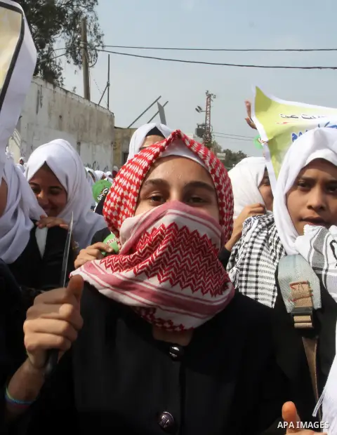 Palestinian school girls take part in an anti-Israel protest in Khan Younis in the southern in Gaza strip, on Oct. 18, 2015. Israel pressed ahead with major security measures after five more stabbing incidents, while ult...