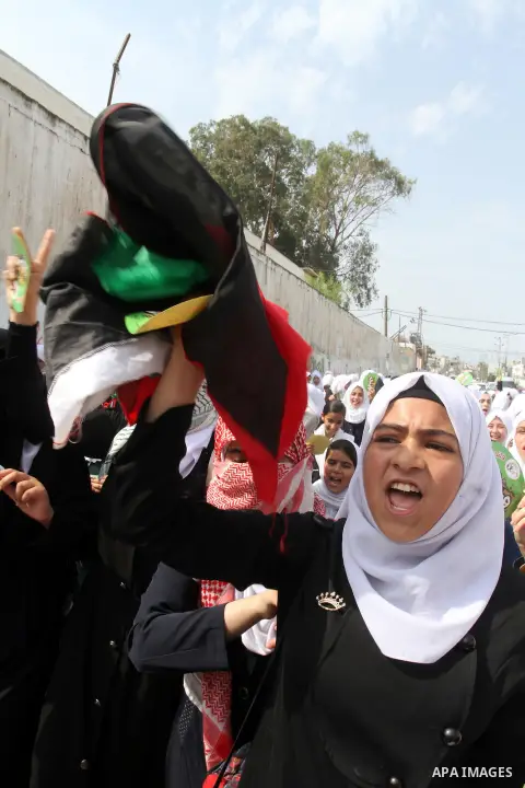 Palestinian school girls take part in an anti-Israel protest in Khan Younis in the southern in Gaza strip, on Oct. 18, 2015. Israel pressed ahead with major security measures after five more stabbing incidents, while ult...