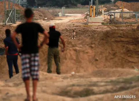 Palestinian protesters clash with Israeli troops near the border between Israel and Central Gaza Strip October 19, 2015. More than two weeks of unrest have raised warnings of the risk of a full-scale Palestinian uprising...