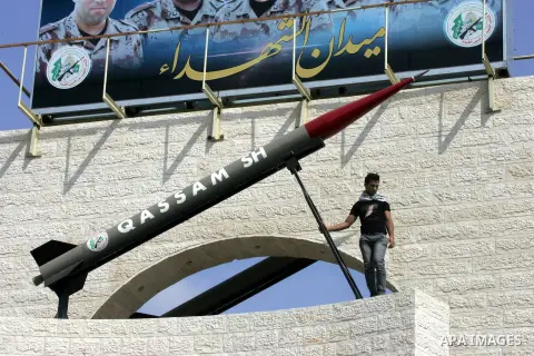 A Palestinian youth stands in front of a mock Qassam rocket during an anti-Israeli protest in Rafah in the southern Gaza Strip, October 20, 2015. Triggered by Israeli incursions into the Al-Aqsa Mosque compound last mont...