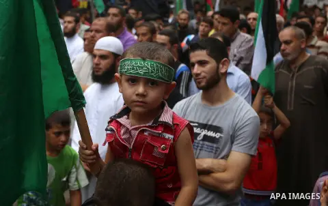Palestinian supporters of Hamas and Islamic Jihad movements take part in an anti-Israeli protest, in Nuseirat refugee camp in central Gaza Strip, October 23, 2015. Palestinian factions called for mass rallies against Isr...