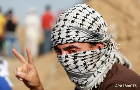 Palestinian protesters participate in clashes with Israeli security forces near the border between Israeli and central Gaza Stirp, on October 23, 2015. Palestinian factions called for mass rallies against Israel in the o...