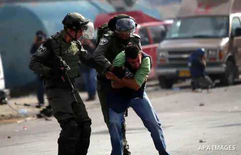 Israeli security forces spray pepper spray at a Palestinian journalist during clashes with Palestinian protesters near the Jewish settlement of Bet El, near the West Bank city of Ramallah, October 30, 2015. Since the sta...