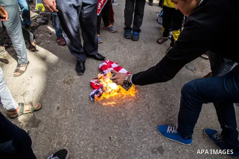 Egyptian protesters burn Israeli and USA flags during an anti-Israel demonstration in Giza district, near Cairo on October 30, 2015. Since the start of October, violence that has included stabbings as well as clashes bet...