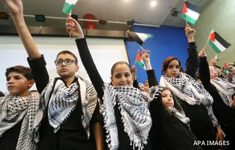 Palestinian children perform during a national festival "Coral" coinciding with West bank, Palestinian territories occupied, and some of Arab and European countries in Gaza city on Nov. 07, 2015. Photo by Mohammed Asad