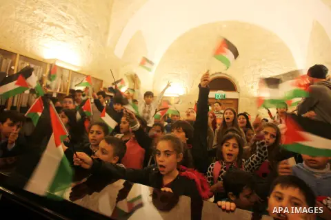 Palestinian children perform during a national festival coinciding with West bank, Palestinian territories occupied, and some of Arab and European countries in Jerusalem's old city on Nov. 07, 2015. Photo by Mahfouz Abu...