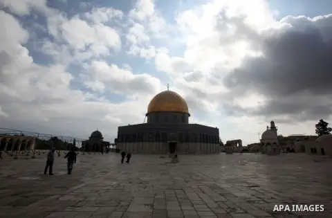 Palestinians walk in front of the Dome of the Rock mosque, during a rainy day in the al-Aqsa mosque comound in Jerusalem's Old City, November 9, 2015. Israel’s civilian planning committee for construction in the West Ban...