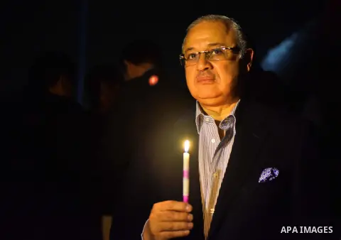 French Ambassador to Egypt Andre Baran, Egyptian minister of Environment Khaled FAHMY, Egyptian antiques minister Mammdouh el-Damati, and Russian Ambassador to Egypt Sergey Kirpichenko hold candles in front of the great...