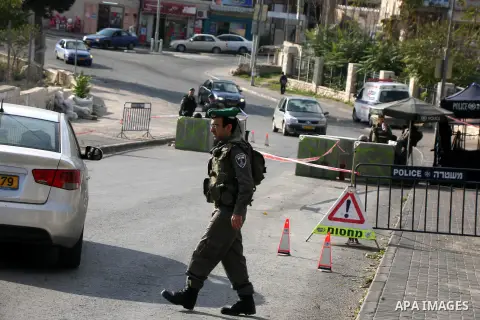 Israeli policemen stand guard at the Israeli checkpoint of Suwaneh quarter, in Jerusalem on November 18, 2015. Last month, a police spokeswoman said that checkpoints were being set up at "the exits of Palestinian village...