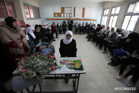 Palestinian colleagues of Ashraqat Qatanani,16, who was killed by Israeli security forces, mourn at their school in Askar refugee camp near the West bank city of nablus, on Nov. 23, 2015. Photo by Nedal Eshtayah