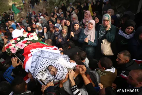 Palestinians carry the body of 16-year-old Ibrahim Dawood during his funeral in the West Bank city of Ramallah, Thursday, Nov. 26, 2015. Ibrahim died of his wounds sustained during clashes with Israeli soldiers two weeks...