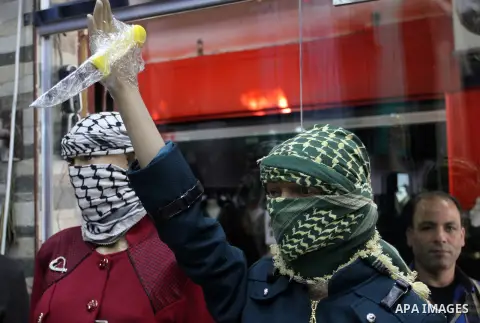A Palestinian man display manikin holding a knife to show solidarity with the al-Aqsa mosque compound ana palestinians in the West Bank, at his shop, in Rafah in the southern Gaza strip, on Nov. 29, 2015. Photo by Abed R...