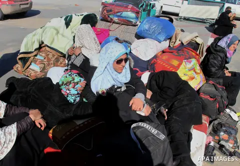 Palestinians wait to cross into Egypt at the Rafah border crossing between Egypt and the southern Gaza Strip December 5, 2015. Photo by Abed Rahim Khatib