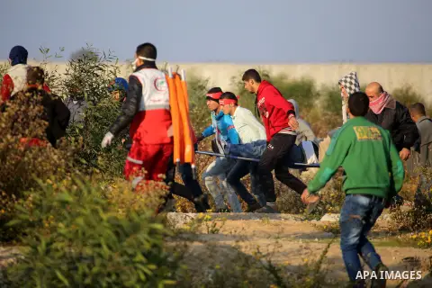 Palestinian protesters clash with Israeli security forces at the Erez crossing checkpoint in the northern Gaza Strip on Dec. 11, 2015. A Palestinian was shot dead and 12 wounded in clashes with Israeli forces on the bord...