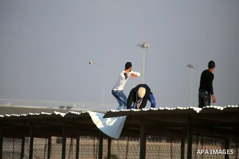 Palestinian protesters clash with Israeli security forces at the Erez crossing checkpoint in the northern Gaza Strip on Dec. 11, 2015. A Palestinian was shot dead and 12 wounded in clashes with Israeli forces on the bord...