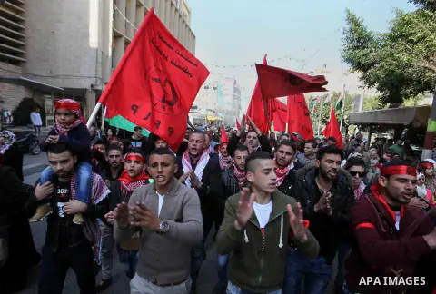Palestinians take part in a demonstration marking the 48th anniversary of the Popular Front for the Liberation of Palestine (PFLP), in the West bank city of nablus, Saturday, Dec. 12, 2015. The PFLP is a hard-line Palest...