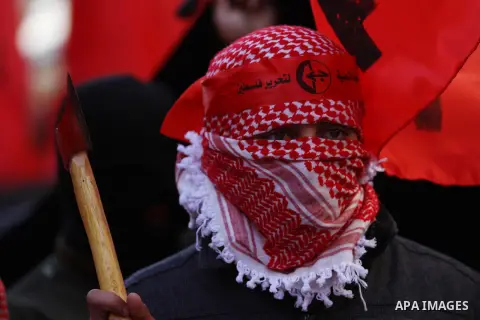 Palestinians take part in a demonstration marking the 48th anniversary of the Popular Front for the Liberation of Palestine (PFLP), in the West bank city of nablus, Saturday, Dec. 12, 2015. The PFLP is a hard-line Palest...
