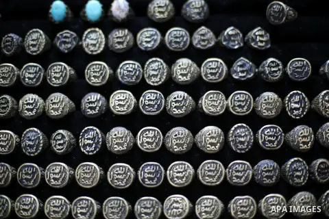 A Palestinian curator displays silver rings at his shop in Gaza city on Dec. 16, 2015. Photo by Mohammed Asad