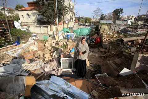 Palestinians inspect the home of the Ibrahim Diab and his daughter Dina was demolished by the Israeli military in the Sheikh Jarrah neighborhood of occupied East Jerusalem on Dec. 16, 2015. The home was 85 square meters...