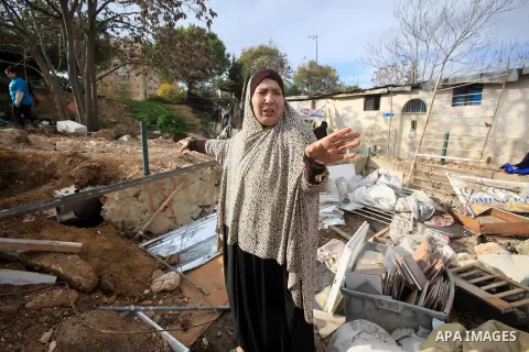 Palestinians inspect the home of the Ibrahim Diab and his daughter Dina was demolished by the Israeli military in the Sheikh Jarrah neighborhood of occupied East Jerusalem on Dec. 16, 2015. The home was 85 square meters...