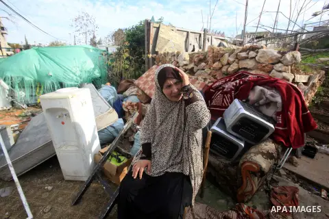 Palestinians inspect the home of the Ibrahim Diab and his daughter Dina was demolished by the Israeli military in the Sheikh Jarrah neighborhood of occupied East Jerusalem on Dec. 16, 2015. The home was 85 square meters...