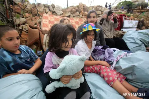 Palestinians inspect the home of the Ibrahim Diab and his daughter Dina was demolished by the Israeli military in the Sheikh Jarrah neighborhood of occupied East Jerusalem on Dec. 16, 2015. The home was 85 square meters...