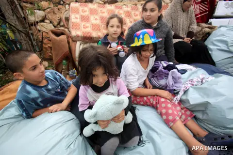 Palestinians inspect the home of the Ibrahim Diab and his daughter Dina was demolished by the Israeli military in the Sheikh Jarrah neighborhood of occupied East Jerusalem on Dec. 16, 2015. The home was 85 square meters...