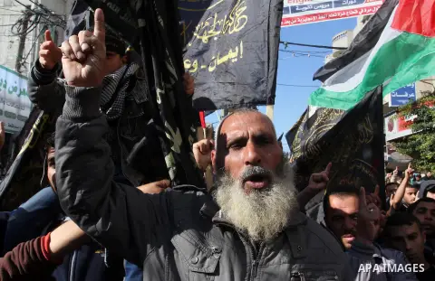 Palestinian Islamic Jihad militants take part in an anti-Israel rally in the town of Rafah in the southern Gaza Strip on December 18, 2015. A wave of violence has hit the Palestinian Territories, Jerusalem and Israel sin...