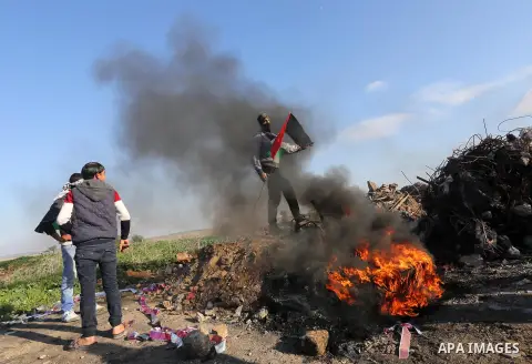 Palestinian protesters clash with Israeli security forces along the border with Israel in the eastern suburbs of Gaza City on December 18, 2015. A wave of violence has hit the Palestinian Territories, Jerusalem and Israe...