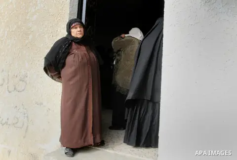 Relatives of Palestinian Mahmoud Al-Aga, 20, whom medics said was killed by Israeli troops during clashes with Palestinian protesters on Friday, mourn during his funeral in Khan Younis in the southern of Gaza Strip Decem...