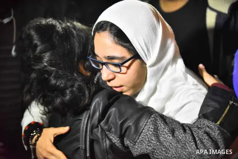 The 23-year-old Activist Esraa al-Taweel leaves the Bulak El Dakrour police station after she was released by the Egyptian court in Cairo, Egypt on December 19, 2015. Al-Taweel was detained in June and continues to face...