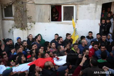 Relatives of 23-year-old Bilal Zayd, who was shot dead as he was attempting to ram his car into an Israeli military post northeast of Jerusalem, carry his body during his funeral on December 24, 2015, in the Qalandiya re...