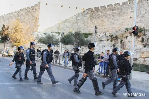 Israeli security forces stand guard and attempt to disperse Palestinian protesters outside Damascus Gate in Jerusalem's old city following a demonstration demanding Israeli authorities to return the bodies of alleged Pal...
