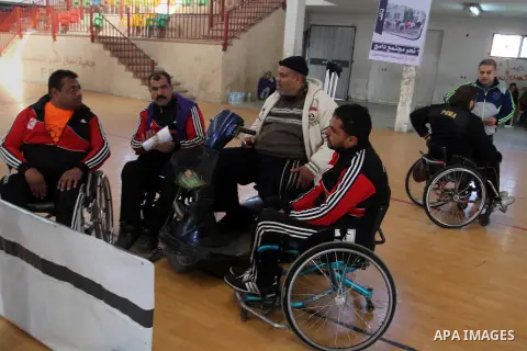Disabled Palestinians play table tennis during the second Rachel Corrie Championship in Khan Younis in the southern Gaza strip on Dec. 30, 2015. Corrie, an American activist for the International Solidarity Movement (ISM...
